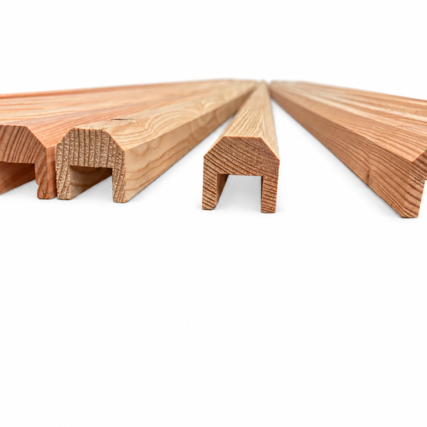 Timber fence capping rails showing grooved ends and chamfered tops